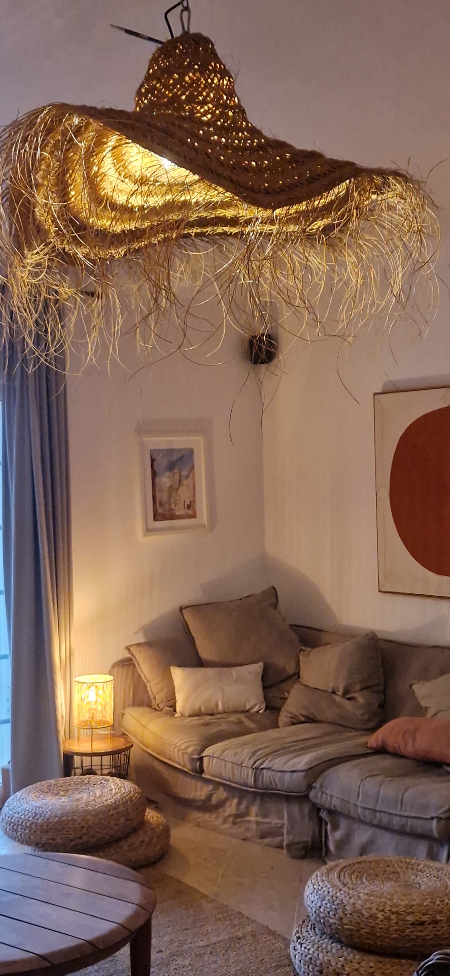 Cozy lounge with rattan lamp at Casa Amani, Algarve